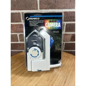 Vintage Norelco Travel Iron Dual voltage steam or dry W/ free Single Use camera